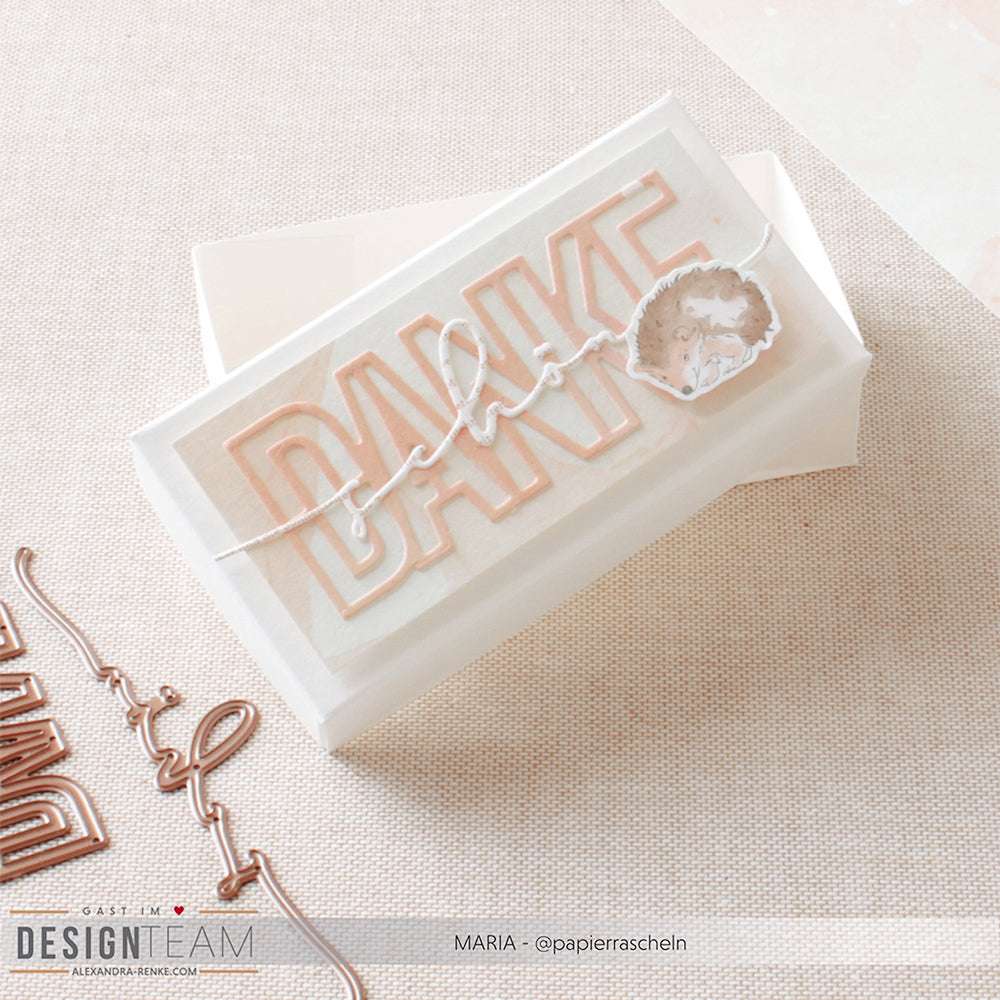 Handgemachte Karte von Alexandra Renke mit "DANKE" und "Prost" auf der Vorderseite, einem Herz, zarten Pastellfarben und aus feinem Designerpapier mit dekorativen Stanzen für einzigartige Details.