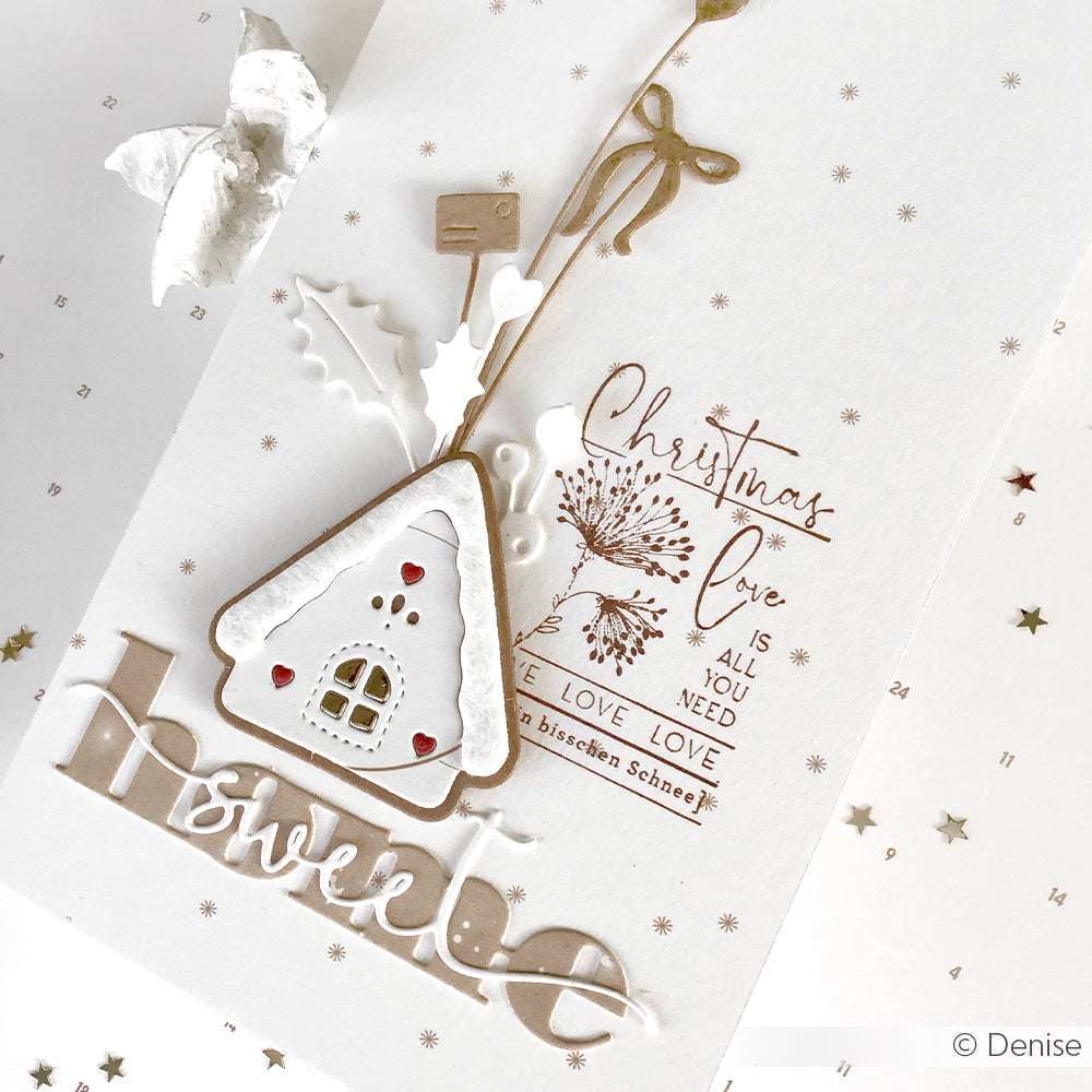 Handgefertigte Weihnachtskarte von Alexandra Renke mit einer Hausverzierung, einem festlichen Text "Home sweet home" aus dem Motivstanze Wörterset und weiß-goldenen Verzierungen auf weißem Hintergrund.