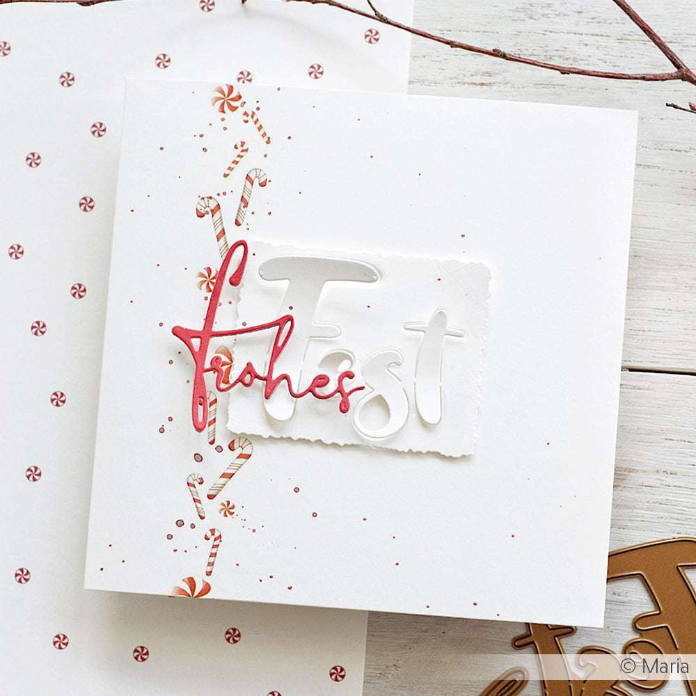 Weiße Weihnachtskarte von Alexandra Renke mit "Frohes Fest" in roter und weißer Schrift mit Zuckerstangenmustern, gestaltet mit der Motivstanze Frohes Fest für einen festlichen Akzent auf hochwertigen Designpapieren.