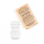 Ein auf Holz montierter Stempel und der dazugehörige Abdruck auf Papier mit einem deutschen Weihnachtsliedtext, der als anschauliches Beispiel für solche Stempelmotive dient.