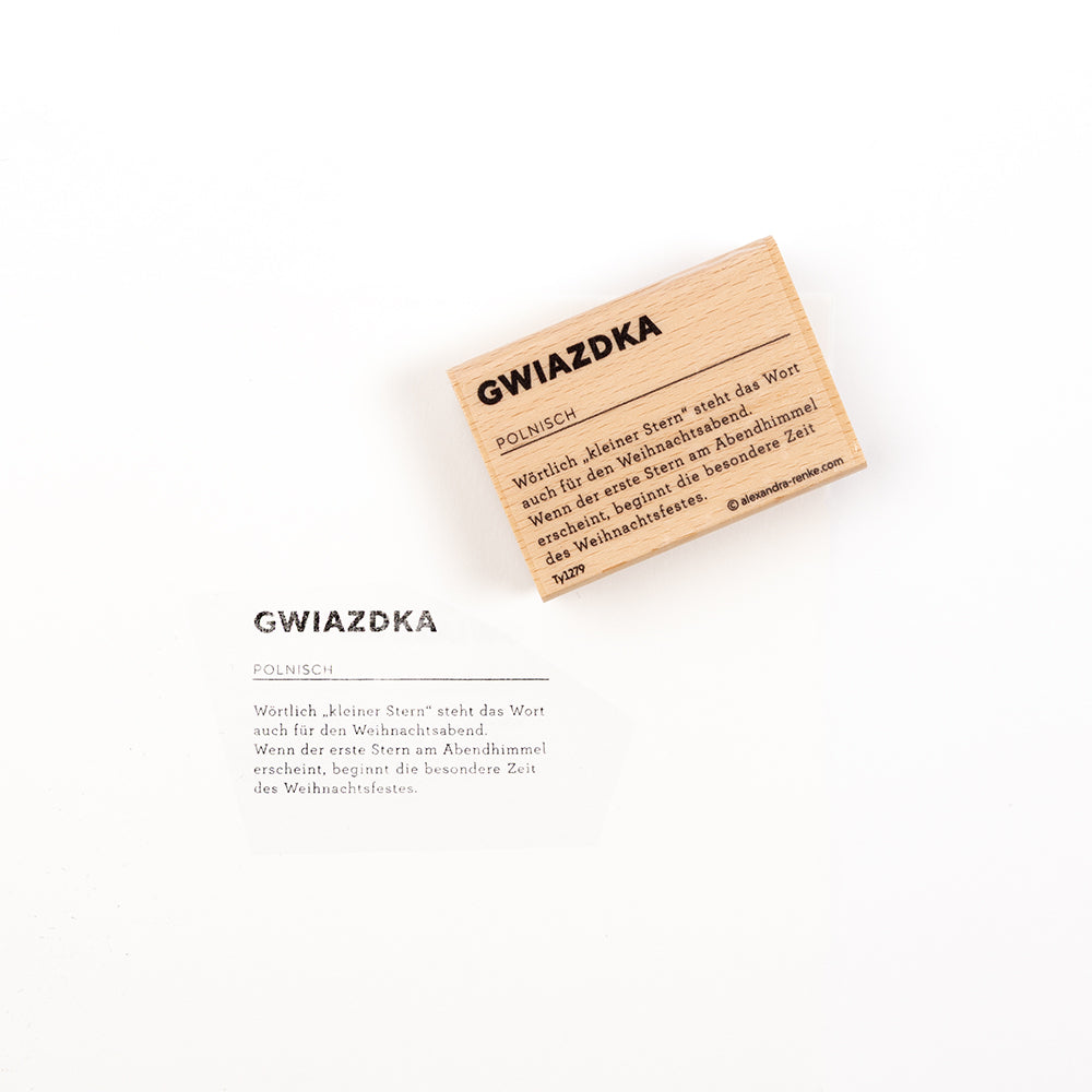 Eine Holzkarte und eine dazu passende Papierkarte mit der Aufschrift „Gwiazdka“ sowie einer deutschen Erklärung des polnischen Wortes – ideal für Holzstempel und Papierprojekte.