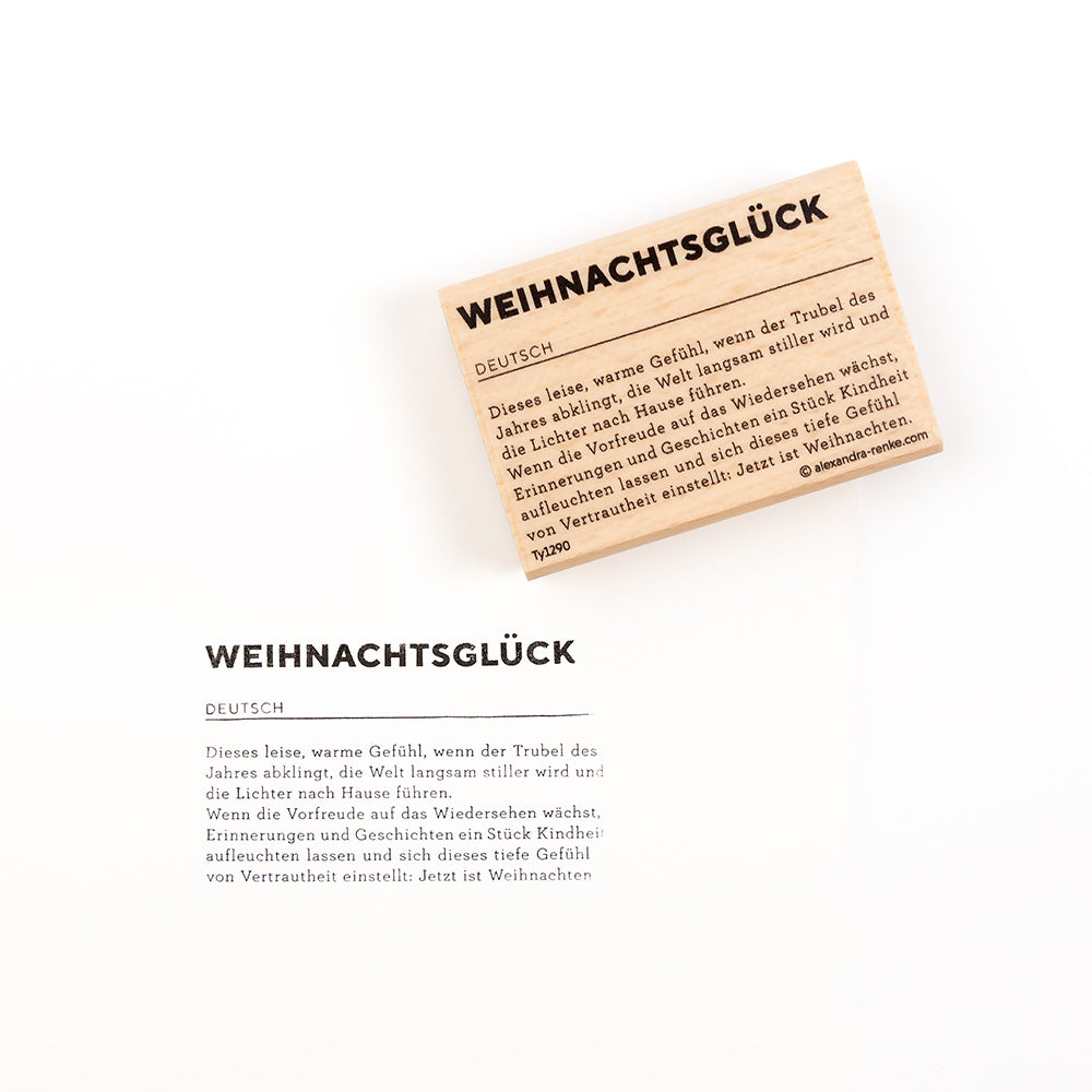 Eine Karte mit dem deutschen Titel „WEIHNACHTSGLÜCK“ und einem Textabschnitt über die Wärme der Weihnachtszeit, gestaltet mit dekorativen Stempelmotiven.