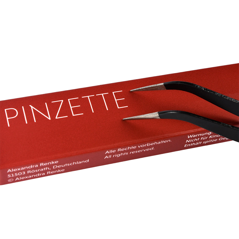 Eine schwarze Alexandra Renke Präzisionspinzette ruht auf einer roten Schachtel mit der Aufschrift "PINZETTE" in weißer Schrift - perfekt für Bastelarbeiten oder Entgittern.