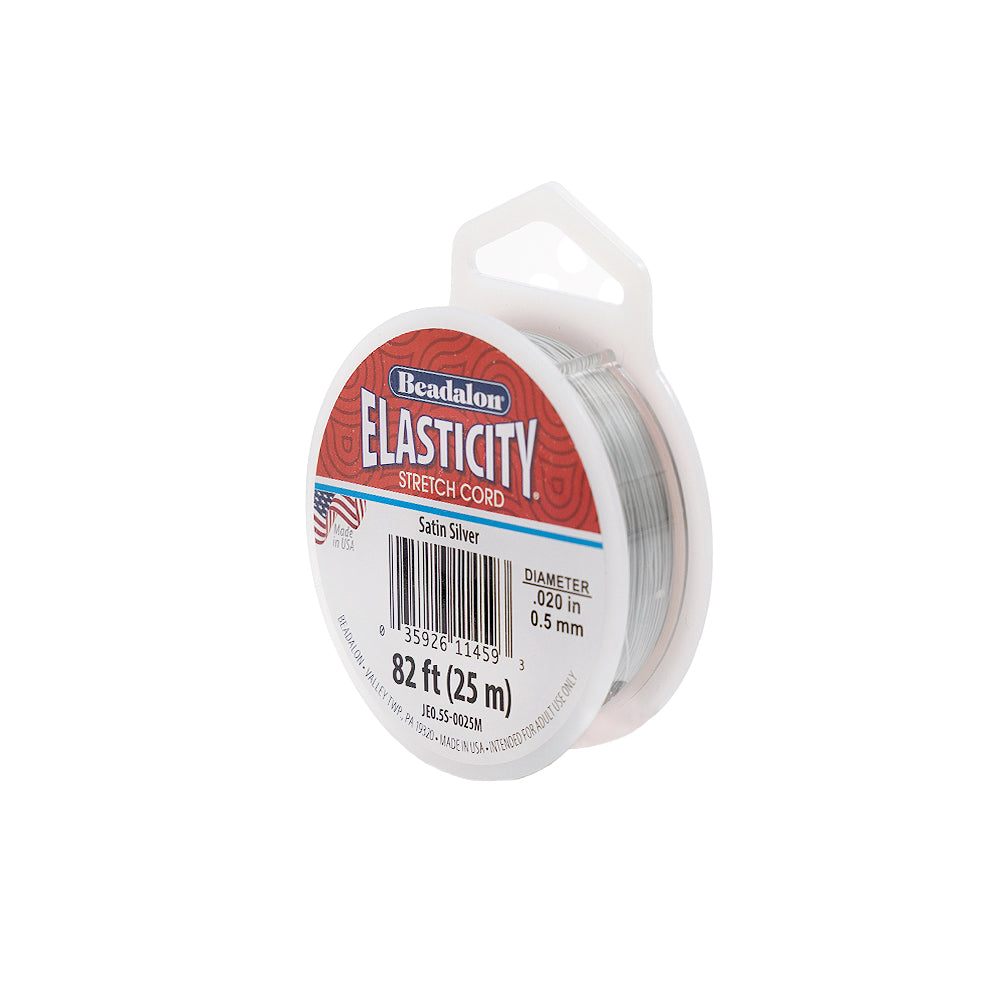 Eine Spule Beadalon Elasticity-Dehnschnur, satin-silber, 0,5 mm dick, 25 m lang, in der Verpackung – ideal als elastische Fädelkordel für die Schmuckherstellung.