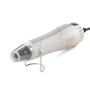 Die beigefarbene Vaessen Heißluftpistole mit Metallständer ist ideal als Prägewerkzeug für Bastelprojekte.