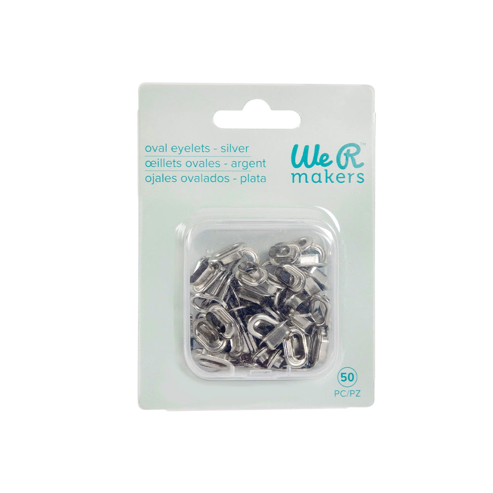 Eine Packung mit 50 silbernen, ovalen Metallösen von Vaessen, ideal für Scrapbooking-Projekte, verpackt in einer durchsichtigen Kunststoff- und weißen Kartonverpackung.