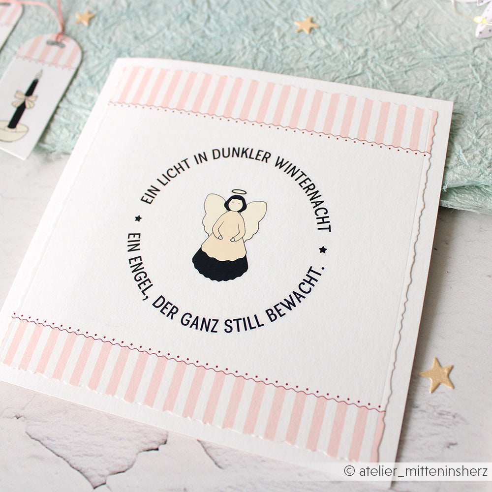 Eine Karte von Alexandra Renke mit einer schlichten Engel-Illustration und deutschem Text, umrandet mit rosa Streifen auf weißem Hintergrund - ideal für Bastelprojekte oder als einzigartiger Geschenkebote.