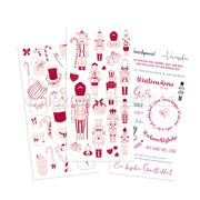 Zwei illustrierte Bögen von Alexandra Renke mit roten und rosafarbenen weihnachtlichen Rub-On-Motiven - Nussknacker, Leckereien, Tassen und deutsche Texte - ideal für Transferfolien Basteln und festliche Winterbasteleien.