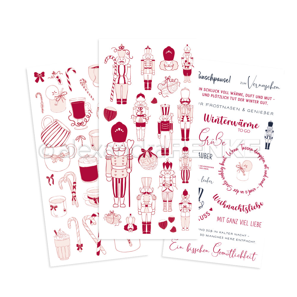 Zwei illustrierte Bögen von Alexandra Renke mit roten und rosafarbenen weihnachtlichen Rub-On-Motiven - Nussknacker, Leckereien, Tassen und deutsche Texte - ideal für Transferfolien Basteln und festliche Winterbasteleien.