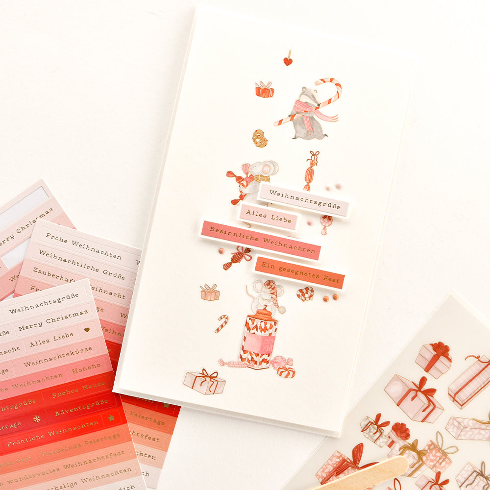 Aufkleberbogen und Abziehbilder zum Thema Weihnachten mit Tier- und Geschenkmotiven im Aquarellstil.