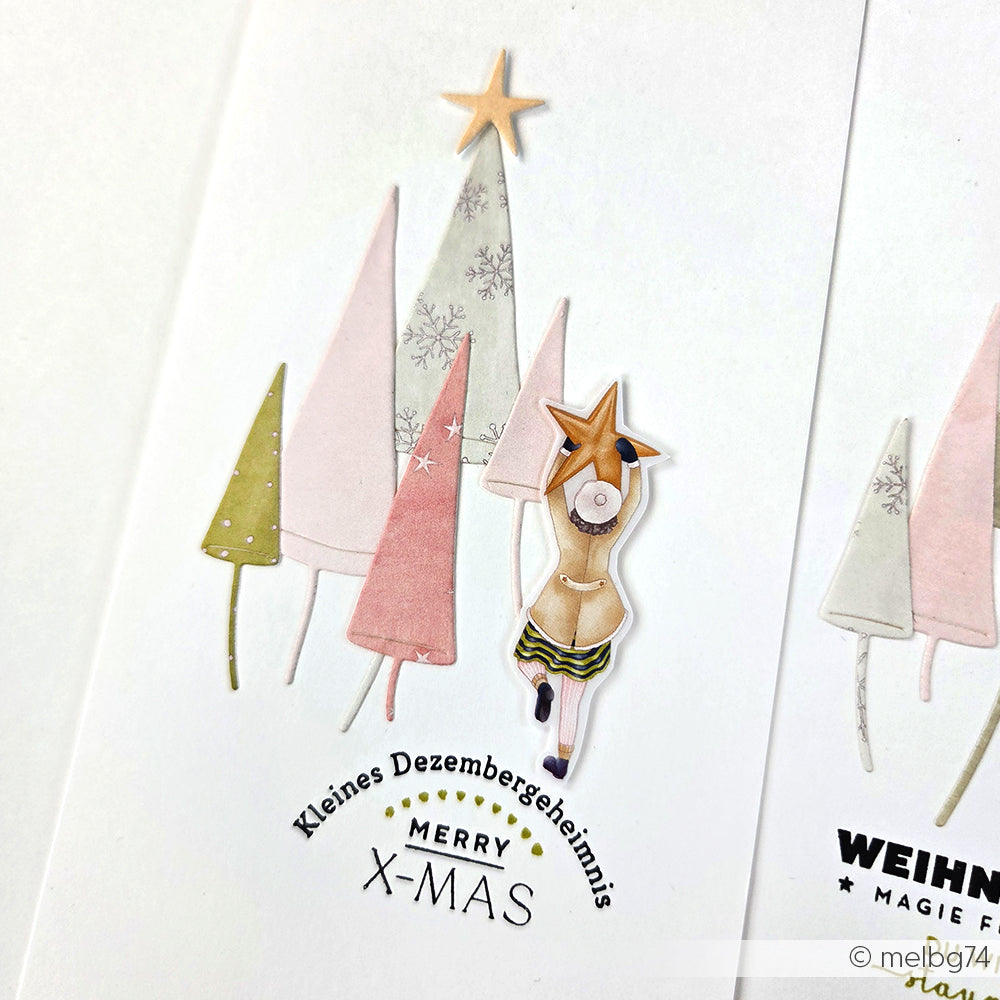 Eine festliche Karte von Alexandra Renke mit pastellfarbenen Bäumen, einem Reh, das einen Stern hält, und "Kleines Dezembergeheimnis MERRY X-MAS" erweckt den Adventszauber zum Leben - ideal zum Basteln mit Clear Stamp oder Photopolymer-Designs.