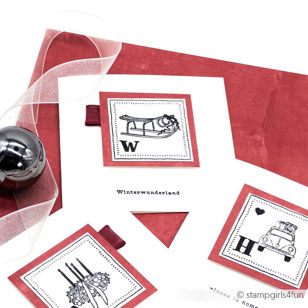 Alexandra Renke-Grußkarten mit winterlichem Schneemotiv, roten Akzenten und einem Band, arrangiert mit einem Metallic-Ornament - ideal, um sie mit Ihren Lieblingsmotiven aus Klarsichtstempeln oder Photopolymer zu kombinieren.