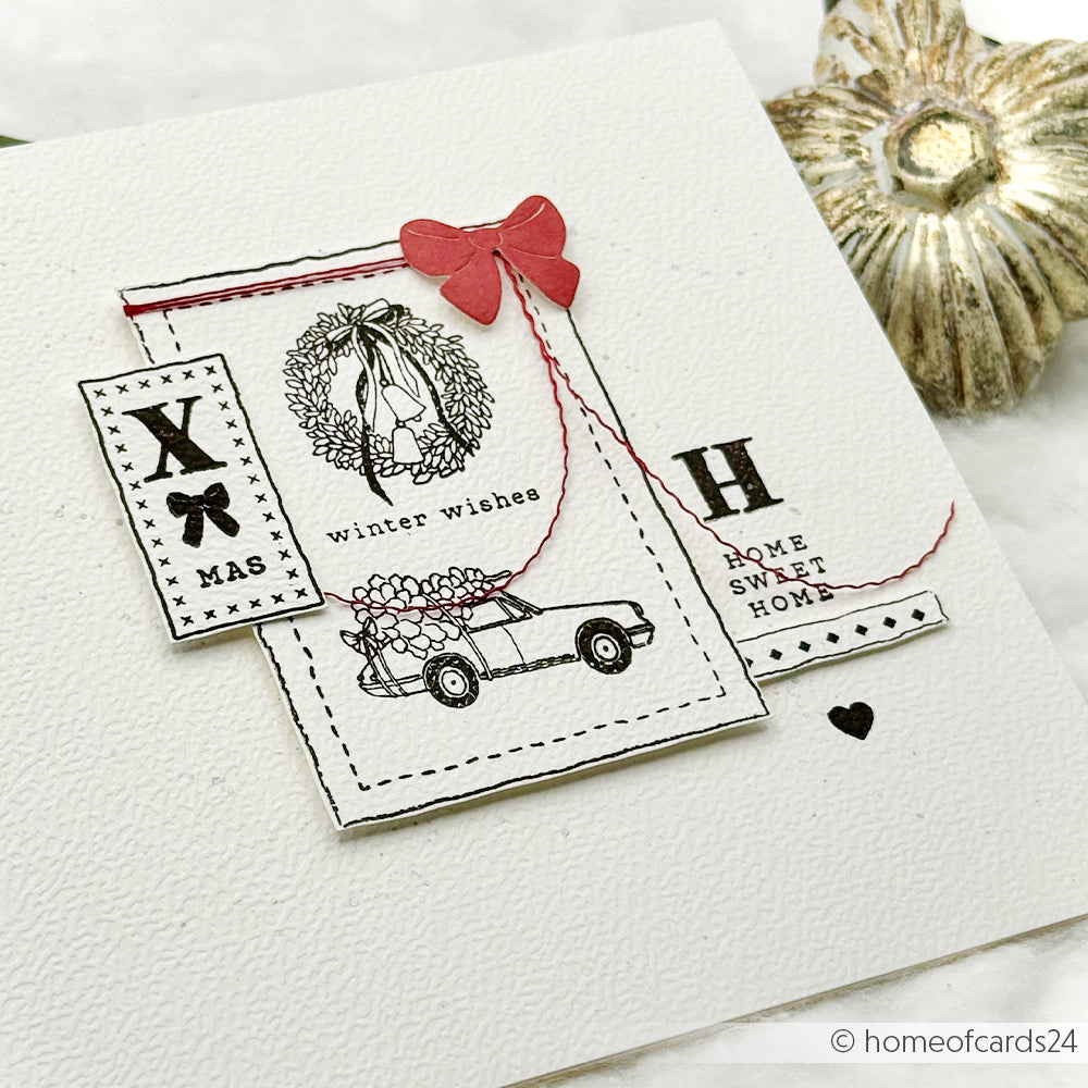 Handgefertigte Weihnachtskarte von Alexandra Renke mit einem Auto, einem Kranz, einer roten Schleife, Winterwünschen und dem Text "Home Sweet Home", hergestellt mit einem Clear Stamp für klare Adventsmotive.