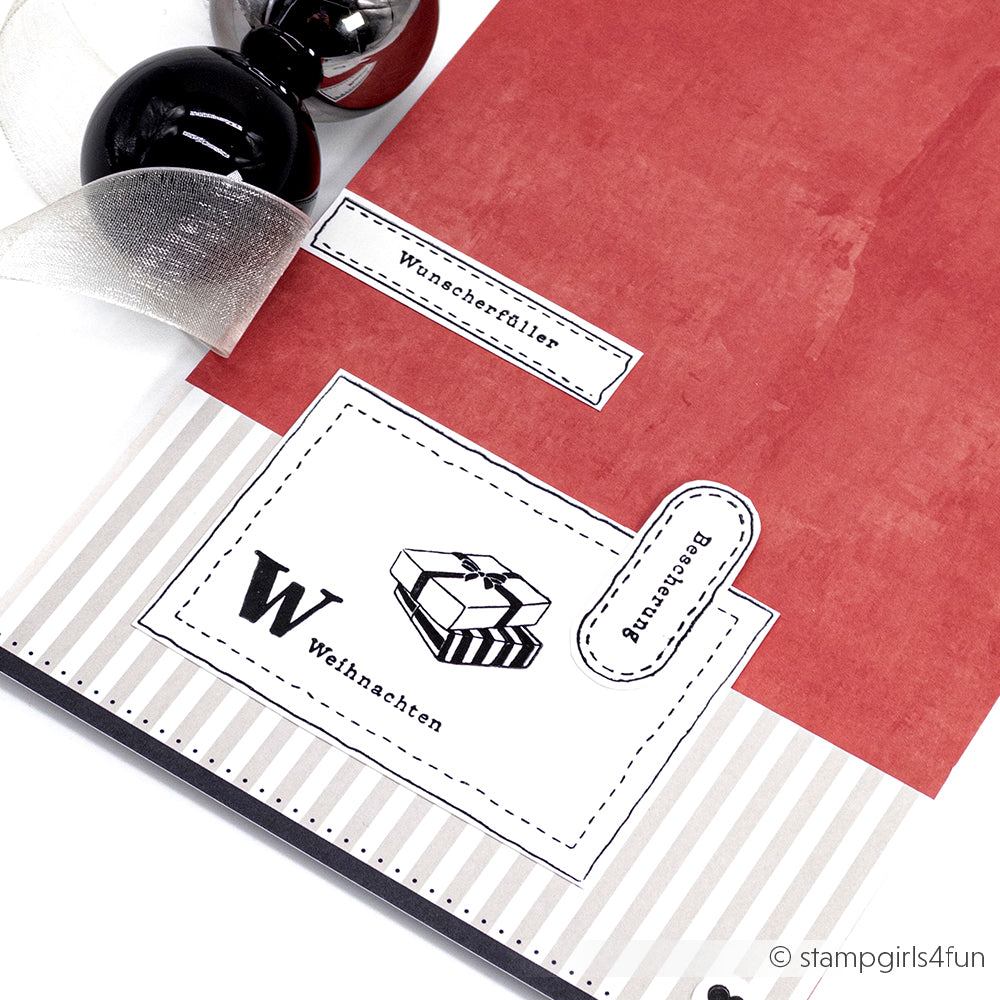 Rot-weiße Weihnachtskarte von Alexandra Renke mit Komposition Weihnachtsfreude, deutschem Text, Geschenkillustration, Schleife, schwarzen Ornamenten und Photopolymer-Klarsichtstempel-Details.