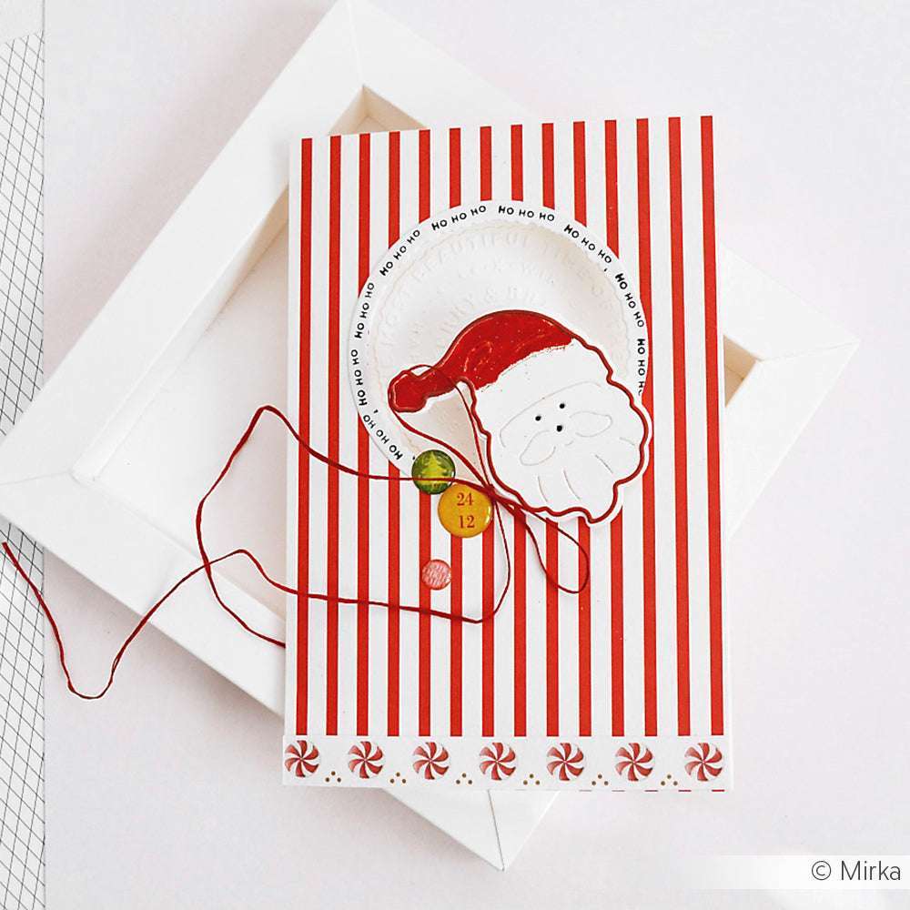 Eine rot-weiß gestreifte Karte von Alexandra Renke mit einem Schicht-Weihnachtsmann-Gesicht, roter Schnur und festlichen Dekorationen, die mit der Motivstanze Weihnachtsmann gefertigt wurden, sorgt für zusätzlichen Weihnachtszauber.