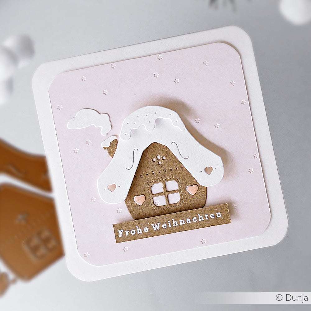 Eine handgemachte Weihnachtskarte von Alexandra Renke mit einem verschneiten Lebkuchenhäuschen und "Frohe Weihnachten" - ideal für Fans von Stanzen für Papierbasteln oder DieCut Systeme.