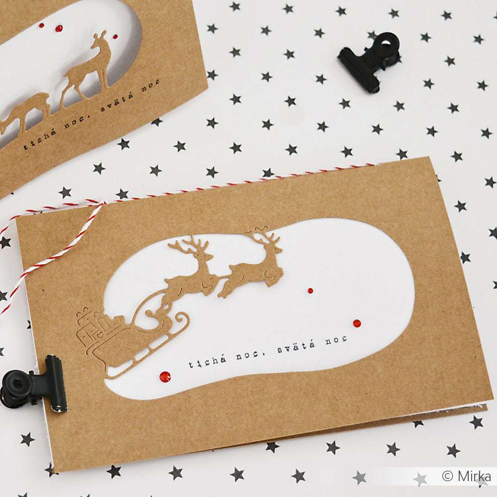 Braune Weihnachtskarte von Alexandra Renke mit einem gestanzten Rentierschlitten, roten Edelsteinen und dem Text "tichá noc, svätá noc".