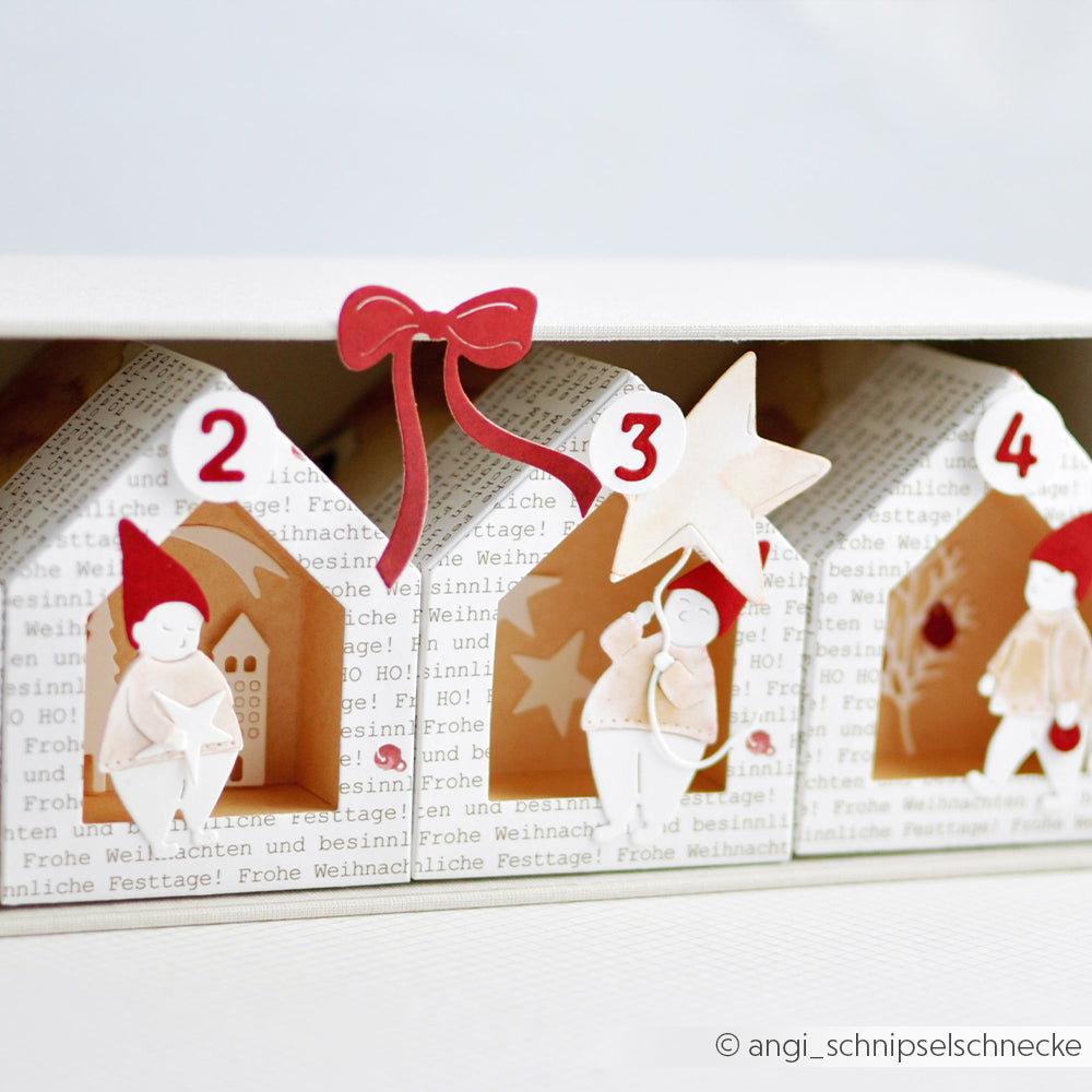 Adventskalender von Alexandra Renke mit Türchen in Hausform mit den Nummern 2, 3 und 4, die jeweils mit weihnachtlichen Figuren aus Designpapieren und der Motivstanze Wichtel Sternzauber geschmückt sind und so für einen magischen Effekt sorgen.