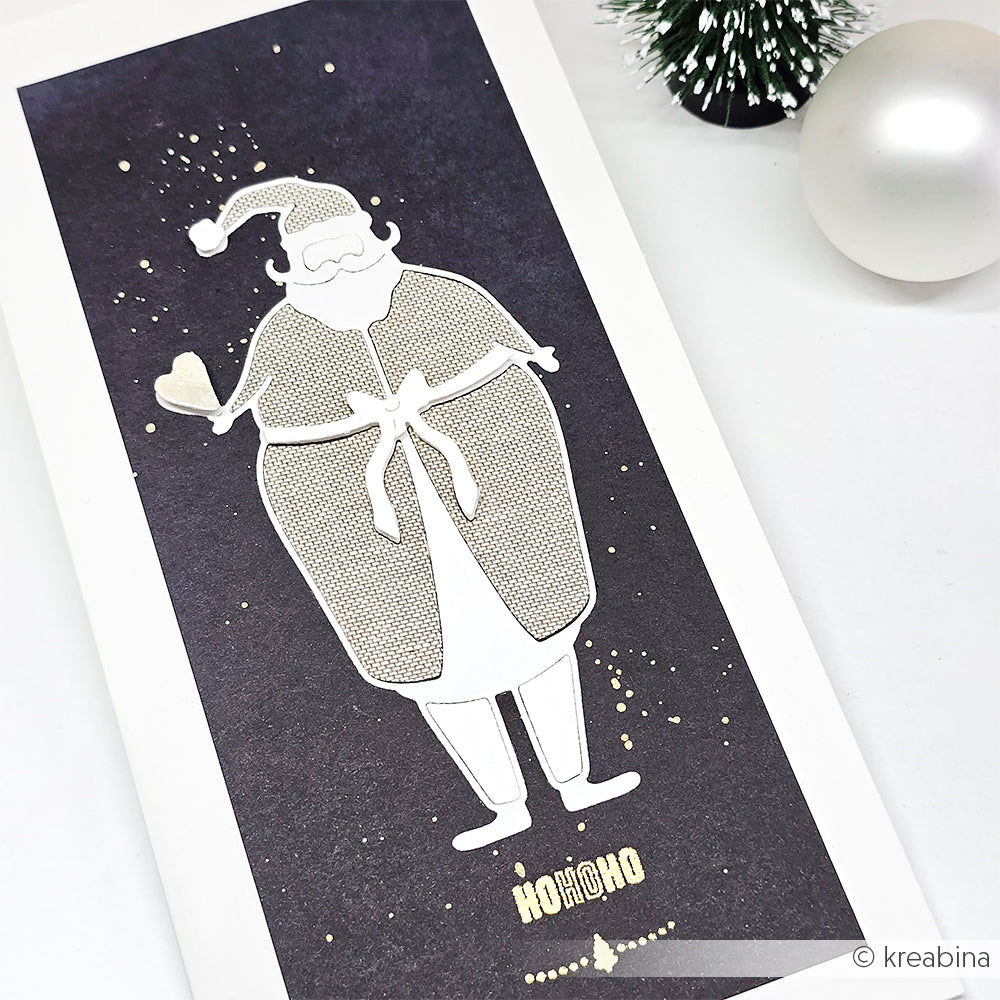 Minimalistische Weihnachtsmann-Illustration auf einer dunklen Alexandra Renke Karte mit HO HO HO und festlichen Dekorationen, hergestellt mit DieCut System für präzise Details.