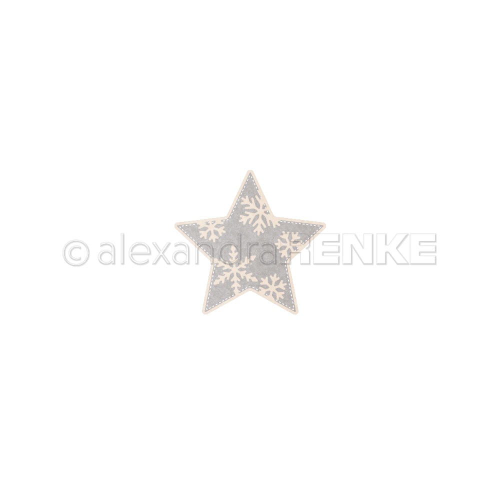 Ein sternförmiges Ornament mit Schneeflockenmuster, das mit der Motivstanze „Schneeflockenstern“ gestaltet wurde.