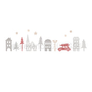 Eine dekorative Illustration eines Feriendorfes mit einer weihnachtlichen Stadtkulisse, bestehend aus Häusern, Bäumen, Sternen und einem Auto, das einen Weihnachtsbaum transportiert.