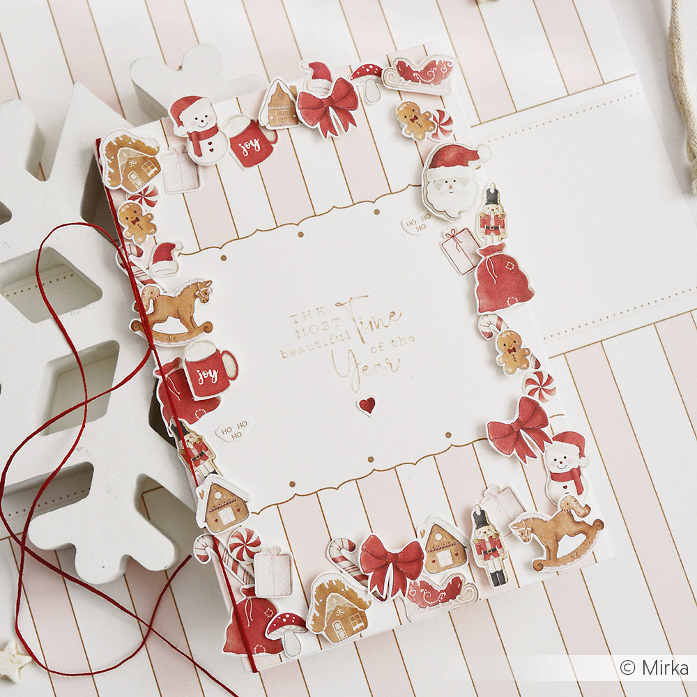 Eine cremefarbene Weihnachtskarte mit detailreichen Motiven und der Aufschrift Die schönste Zeit des Jahres.