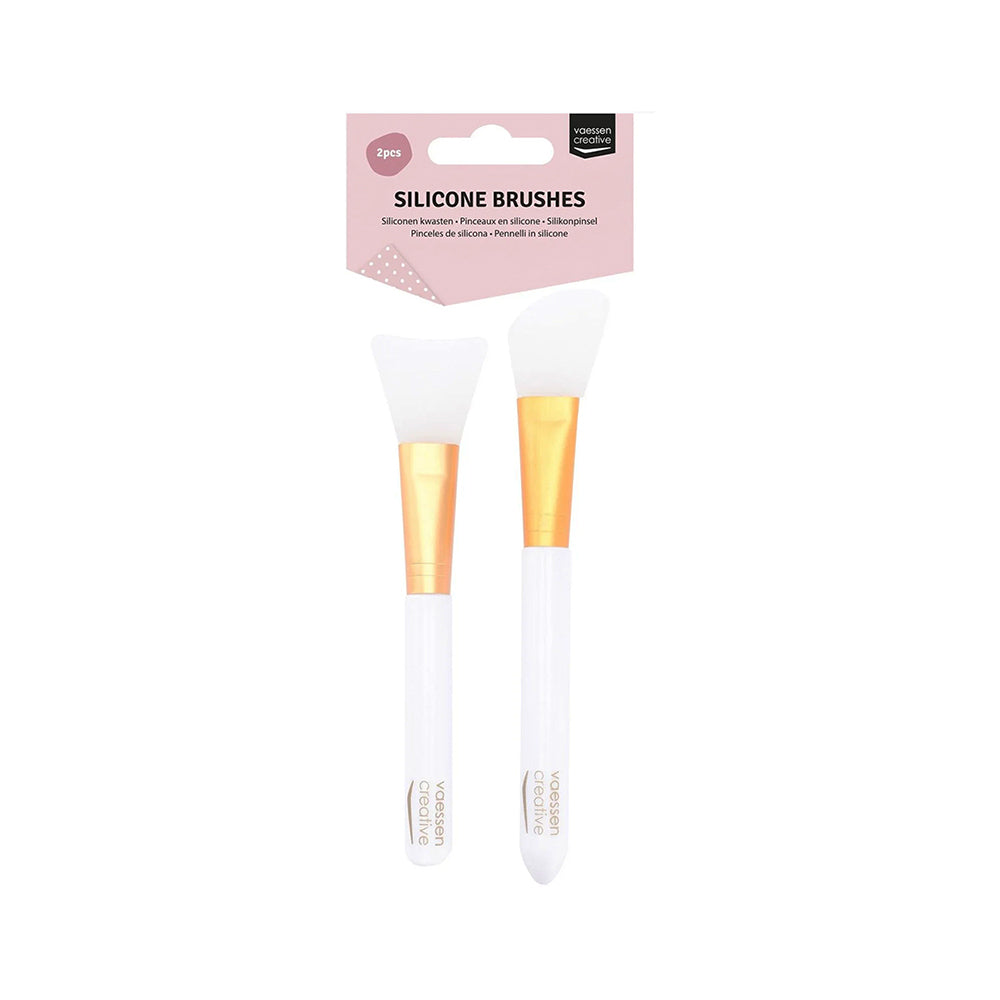 Zwei Vaessen Silikonpinsel in Weiß und Gold in durchsichtiger 2er-Verpackung - perfekt für Strukturpaste oder Mixed-Media-Projekte.